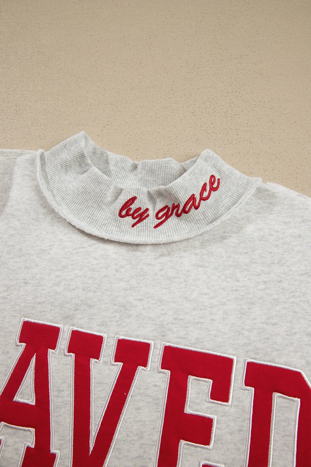 Saved By Grace Embroidered Graphic Mock Neck Sweatshirt
